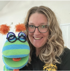 Becca, Music Monsters Franchisee owner, teaching class with puppet