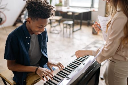 Teaching of student on the piano